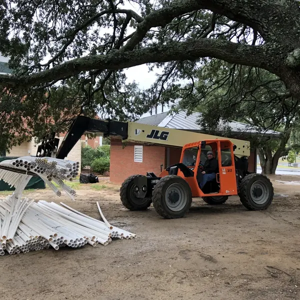 PVC irrigation pipe staged on site for a new sprinkler system