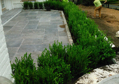 Irrigation work beside a finished walkway